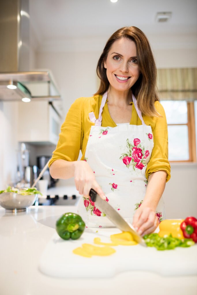 woman cutting vegetables chopping board 1